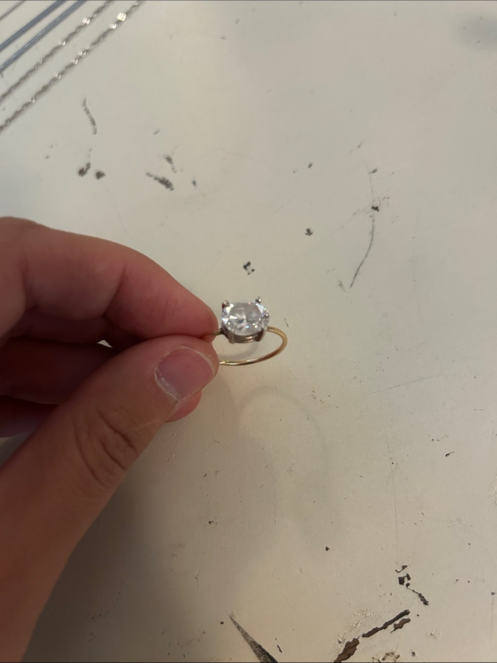 Gold Solitaire Ring with Clear Round Stone